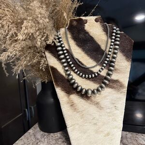Real zebra hide necklace stand. Pearls not included.